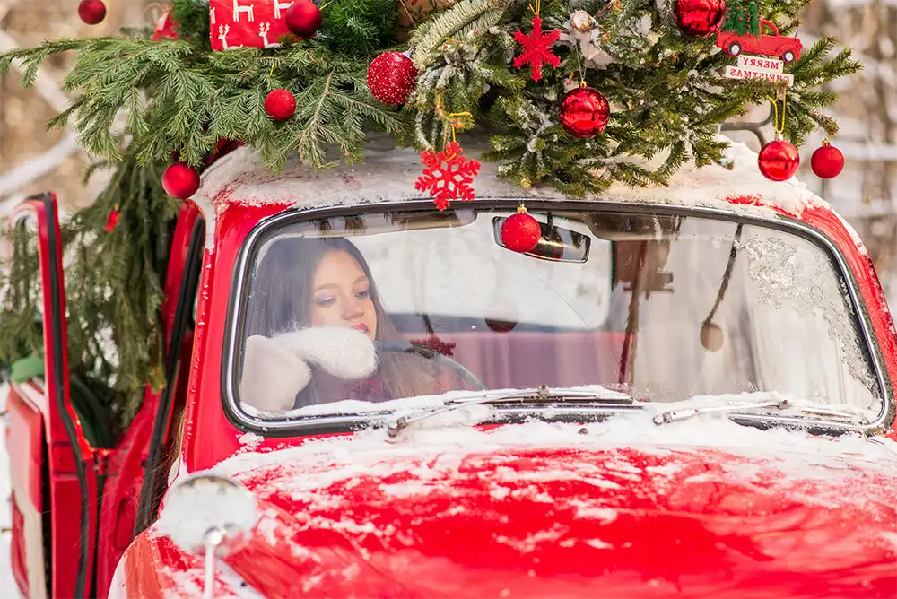 Woman driving at Christmas